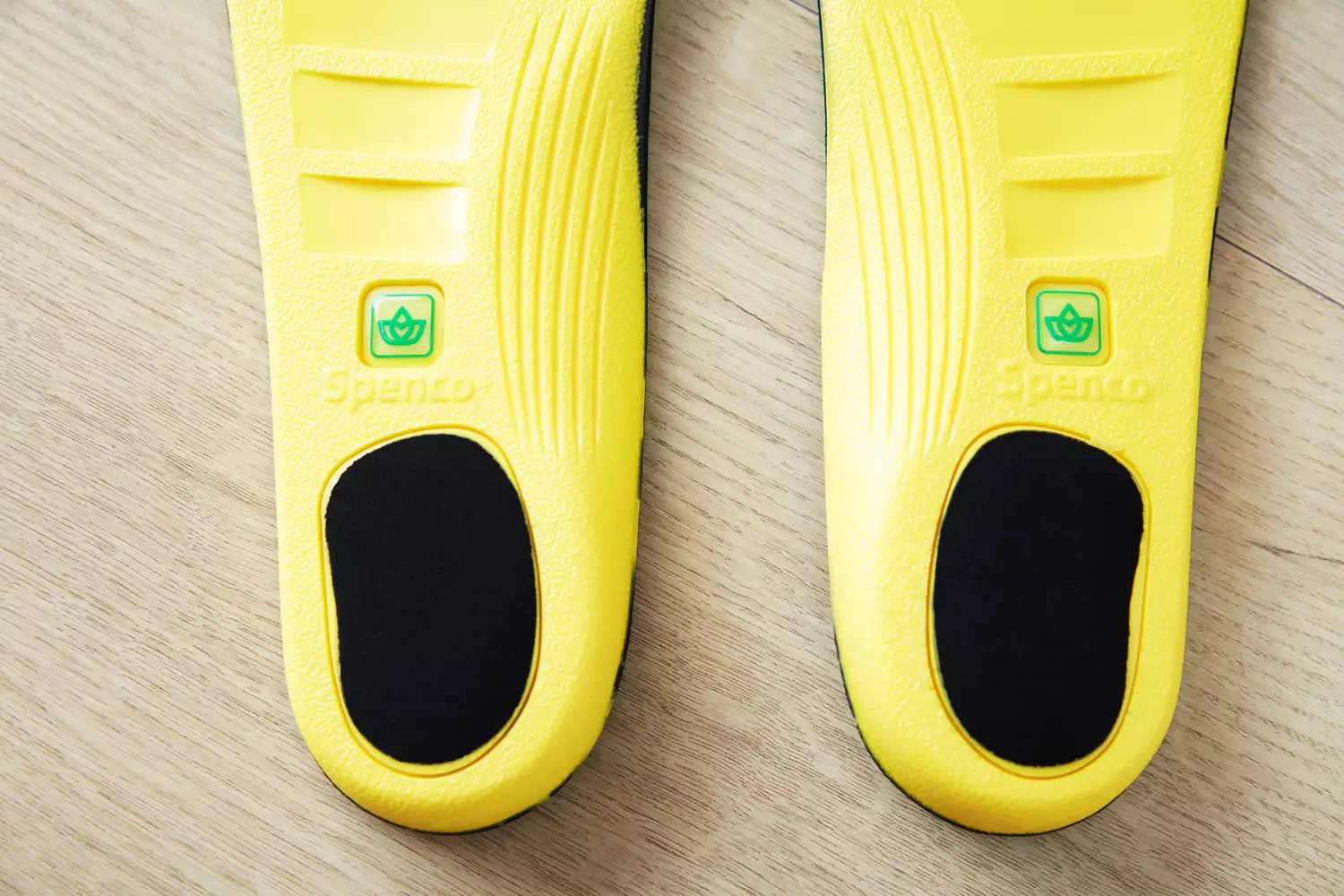 Closeup of the heels of the Spenco PolySorb Cross Trainer Insoles