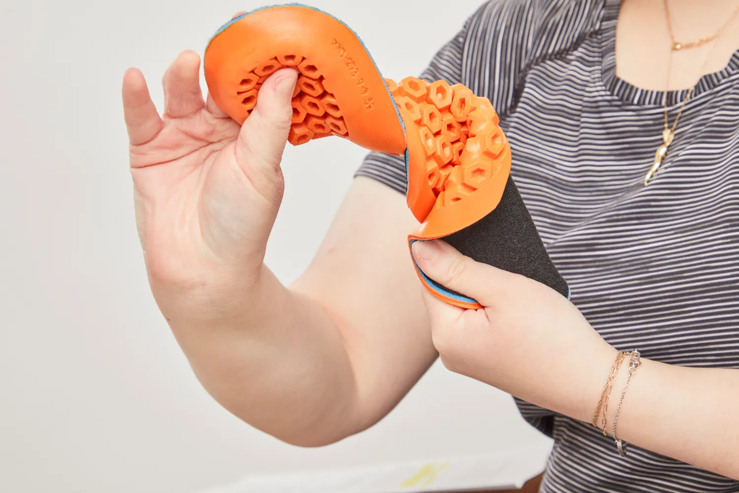 Person twisting a Timberland Pro Anti-Fatigue Technology Insole