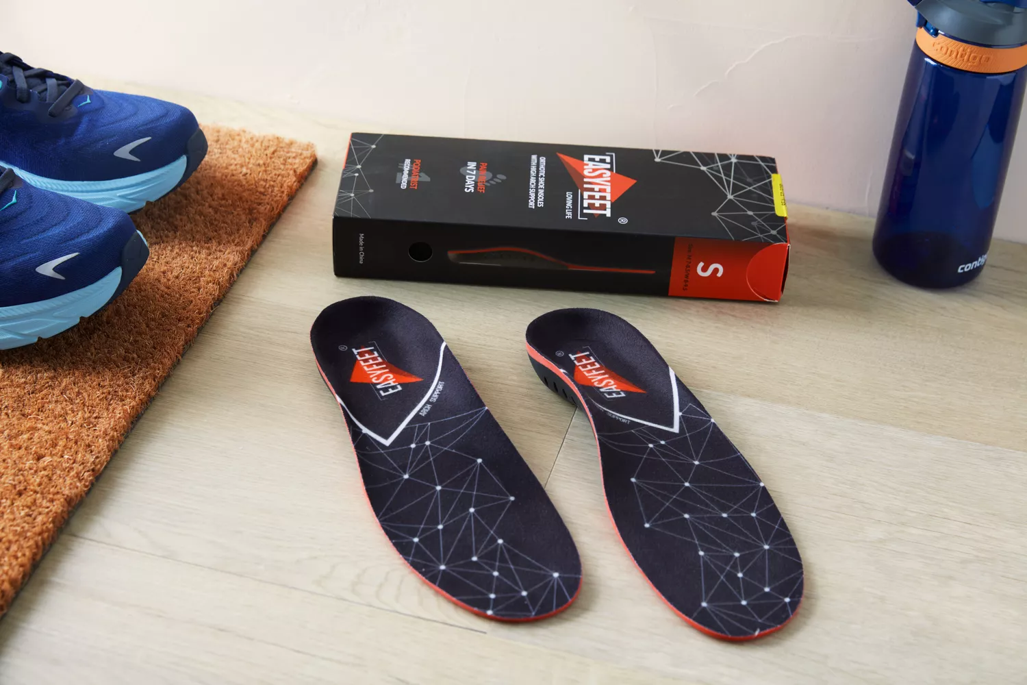 EasyFeet Plantar Fasciitis Arch Support Insoles displayed on a wood floor with product box