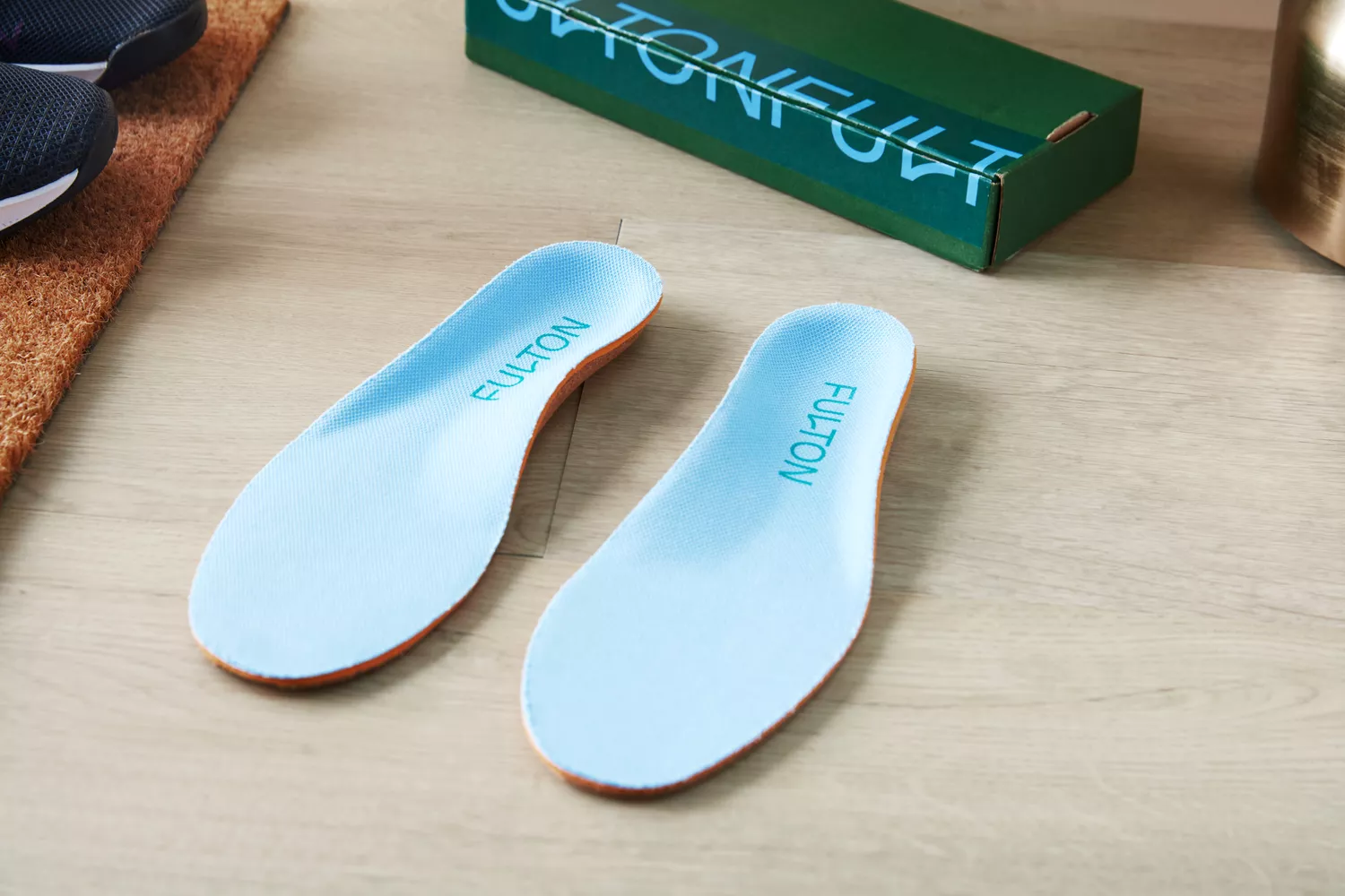 Fulton Athletic Insoles displayed on a wood floor