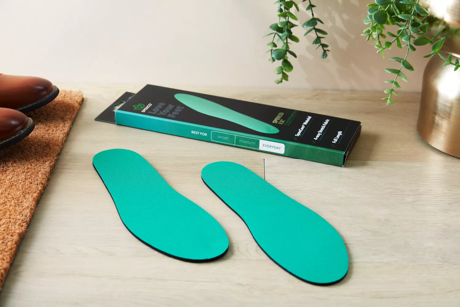 Spenco RX Comfort Insoles on a wooden floor next to the box