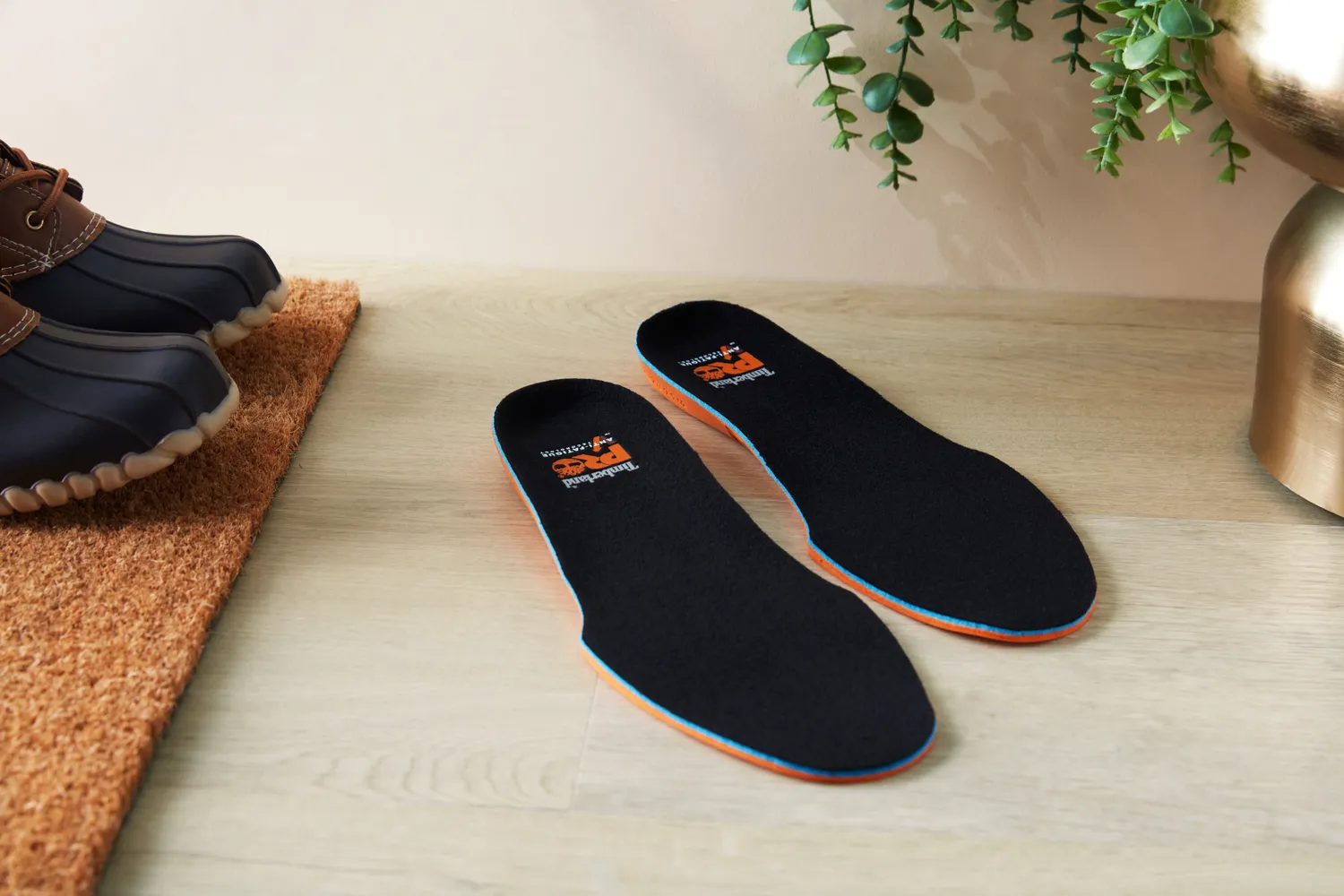 Timberland Pro Anti-Fatigue Technology Insoles displayed on a wood floor