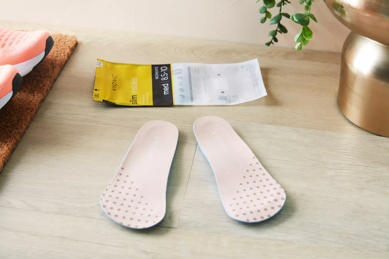 Vionic Slimfit Orthotic Insoles displayed on a wood floor
