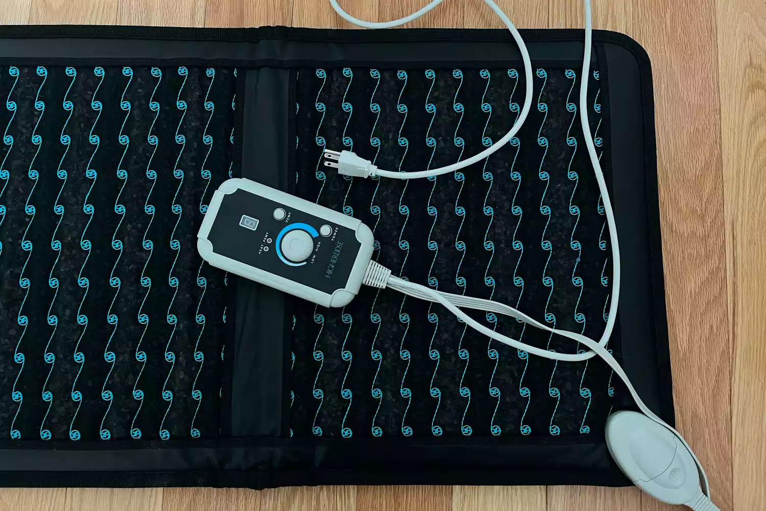 Closeup of Higher Dose Infrared PEMF Go Mat on wood floor