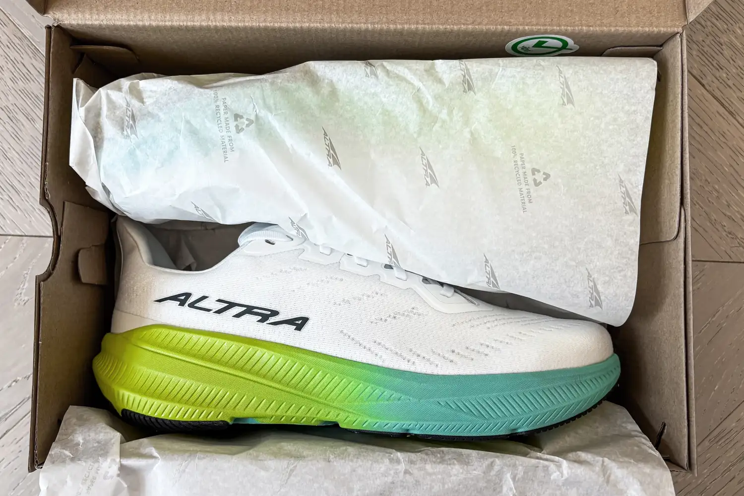 A pair of Altra Men's Experience Flow 2 Sneakers in a box