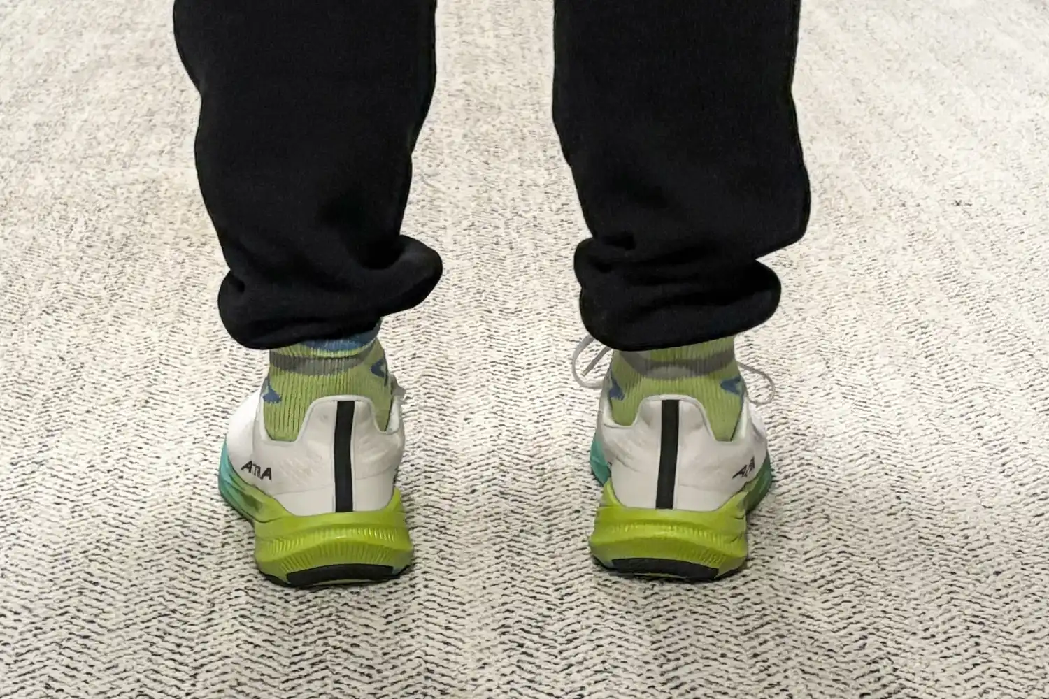 The back of a person wearing the Altra Men's Experience Flow 2 Sneakers