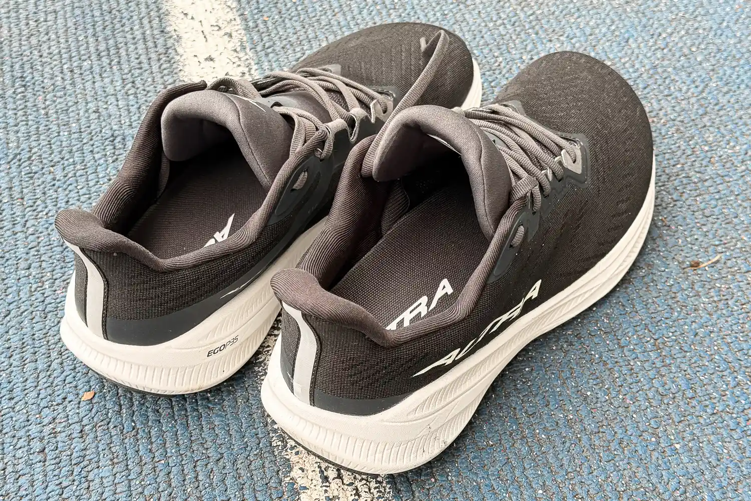 The Altra Men's Experience Flow 2 Sneakers on outdoor carpet