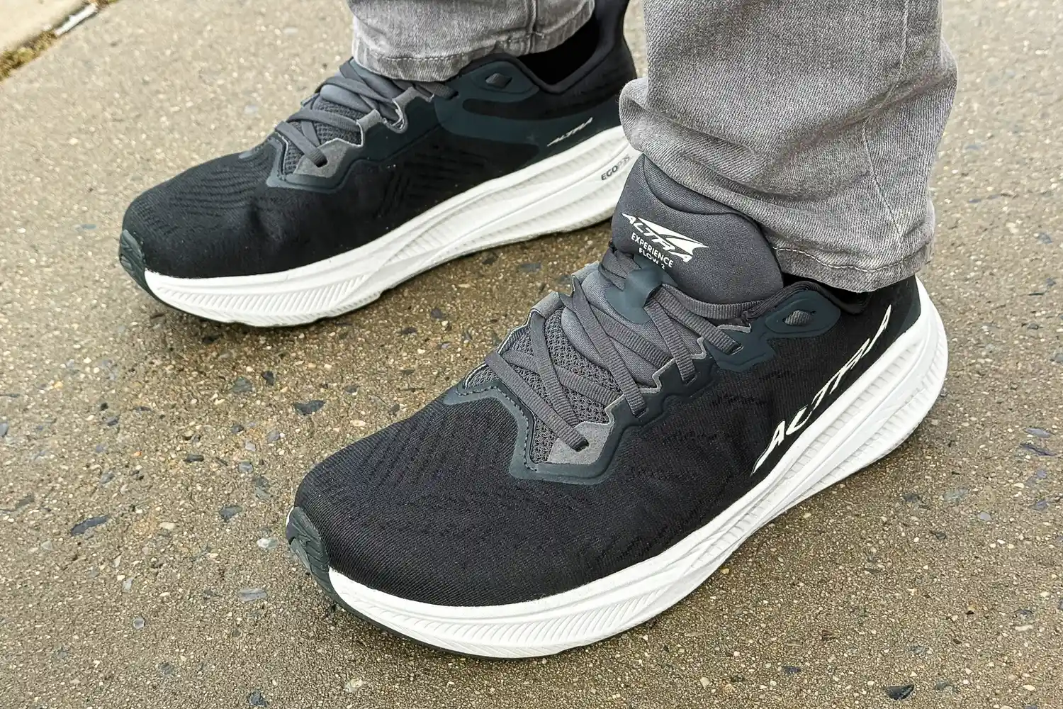 A person wears the Altra Men's Experience Flow 2 Sneakers