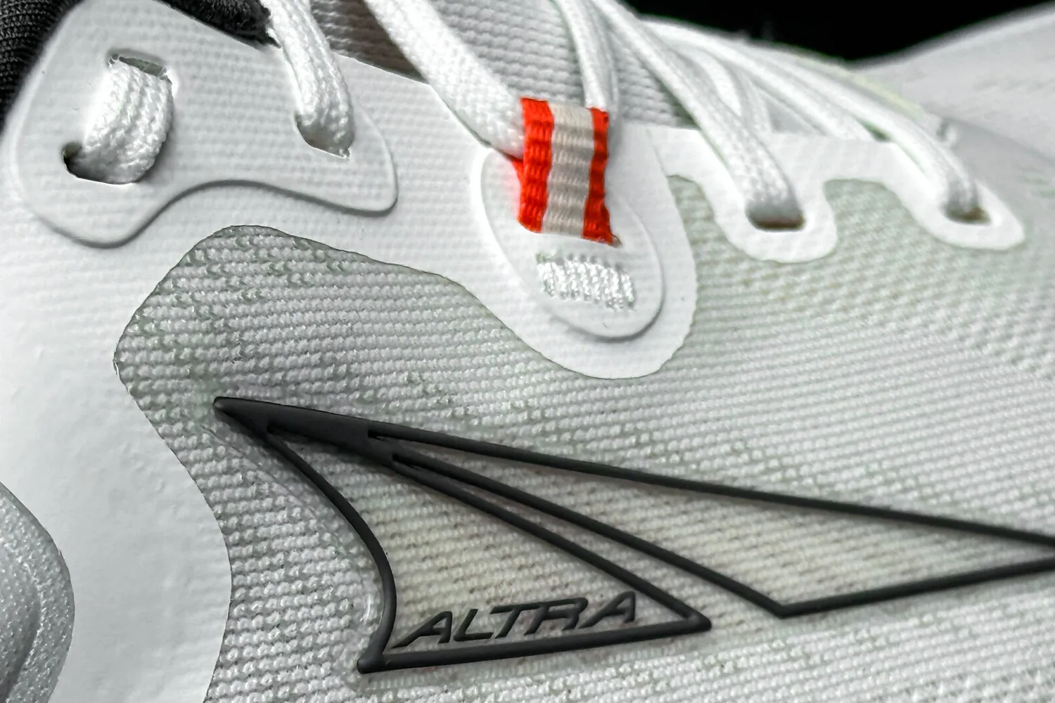 A close-up of the brand name and logo on the Altra Men's Paradigm 7 Sneaker