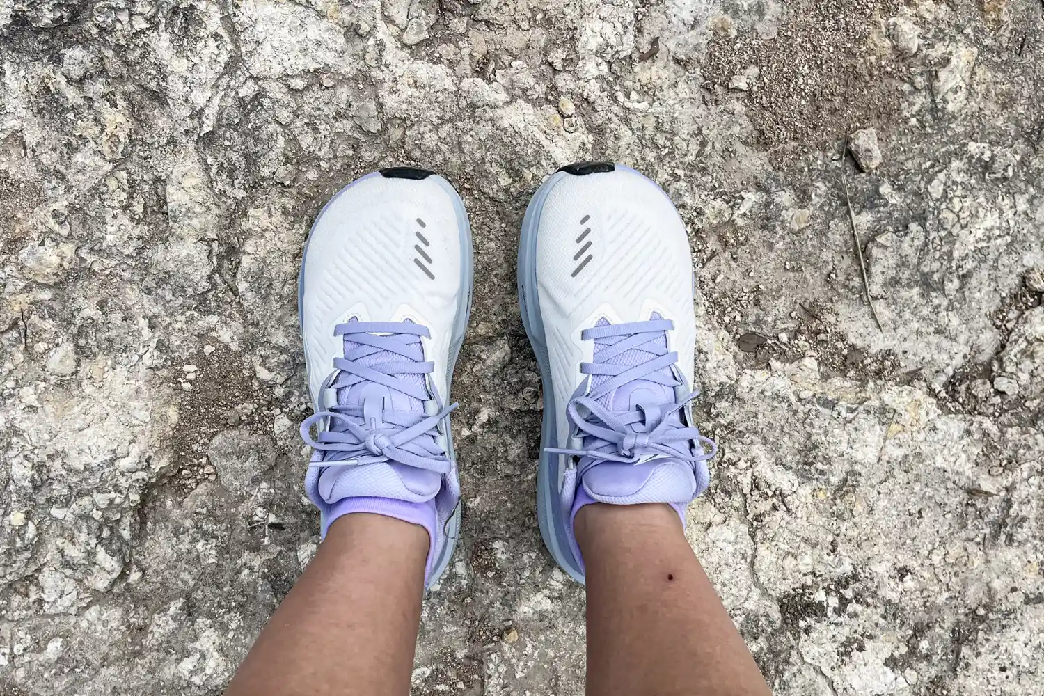 A person wears the Altra Women's Paradigm 8 Running Shoes outside