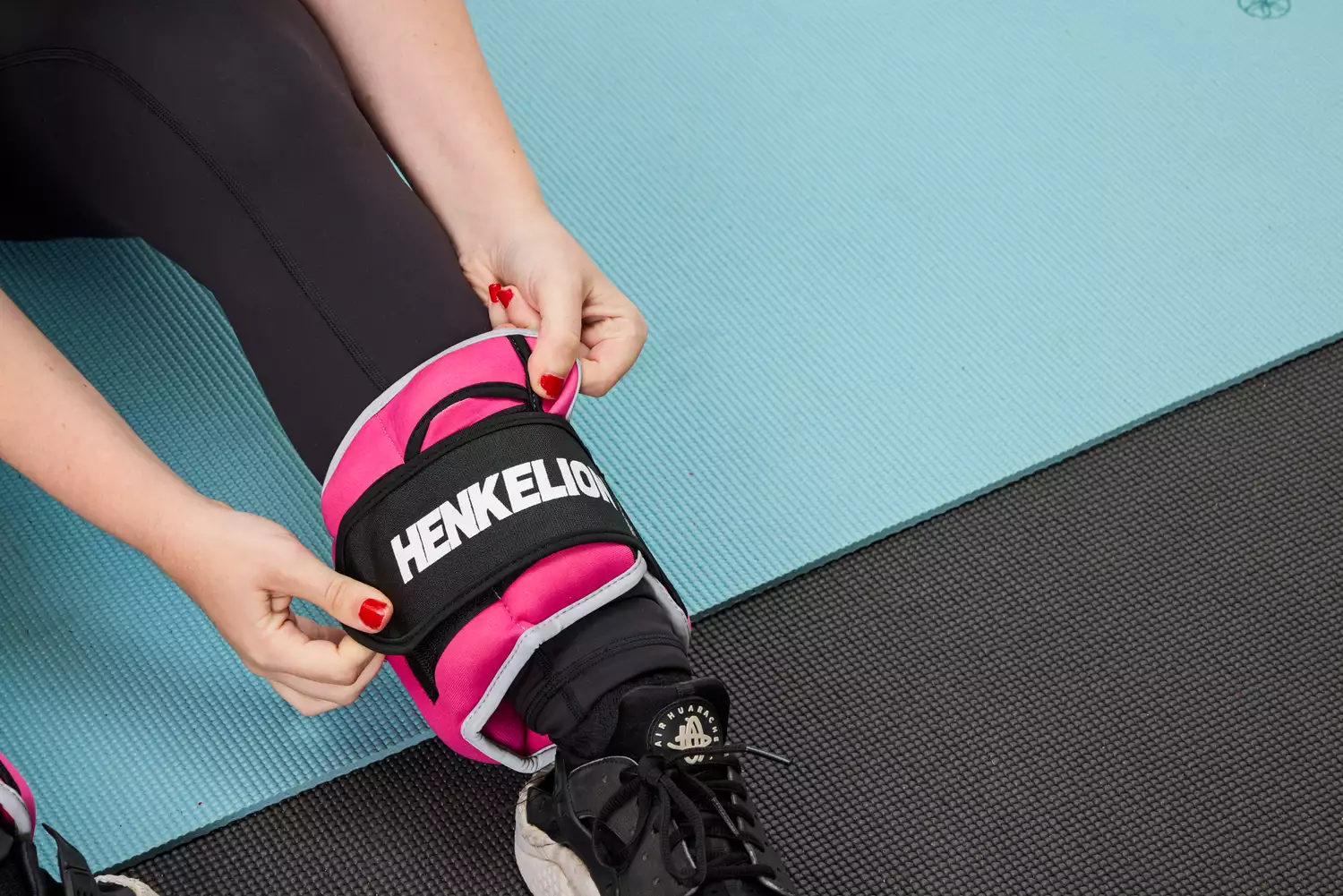 A person wears the Henkelion Adjustable Ankle Weights