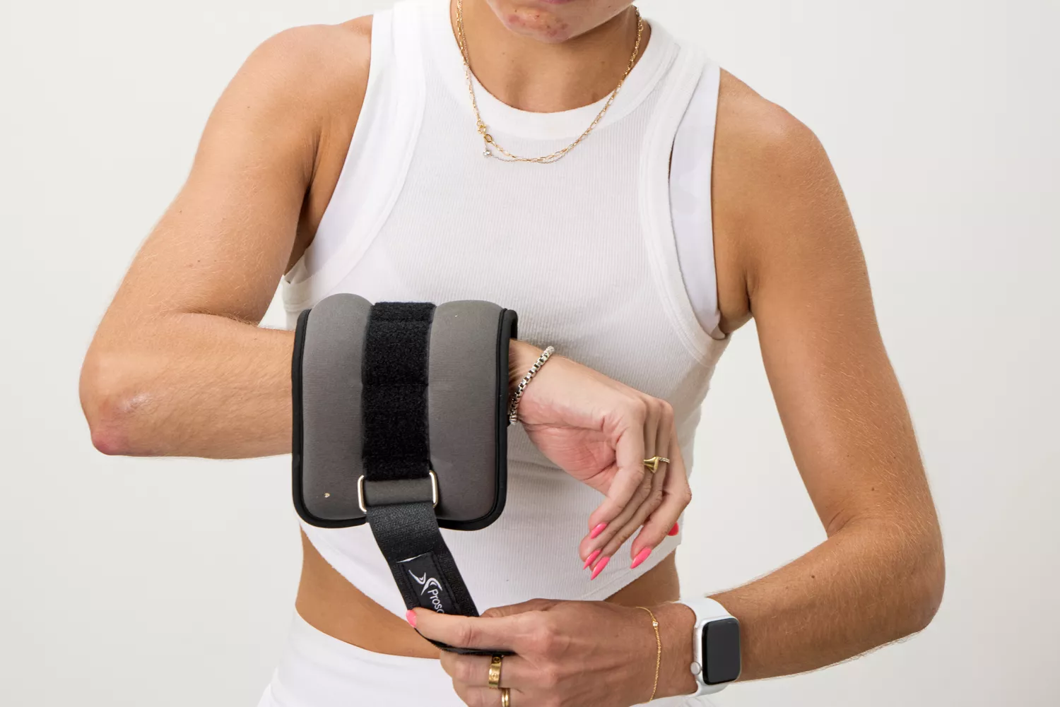 A person tightens the strap on the ProsourceFit Ankle/Wrist and Arm/Leg Weights