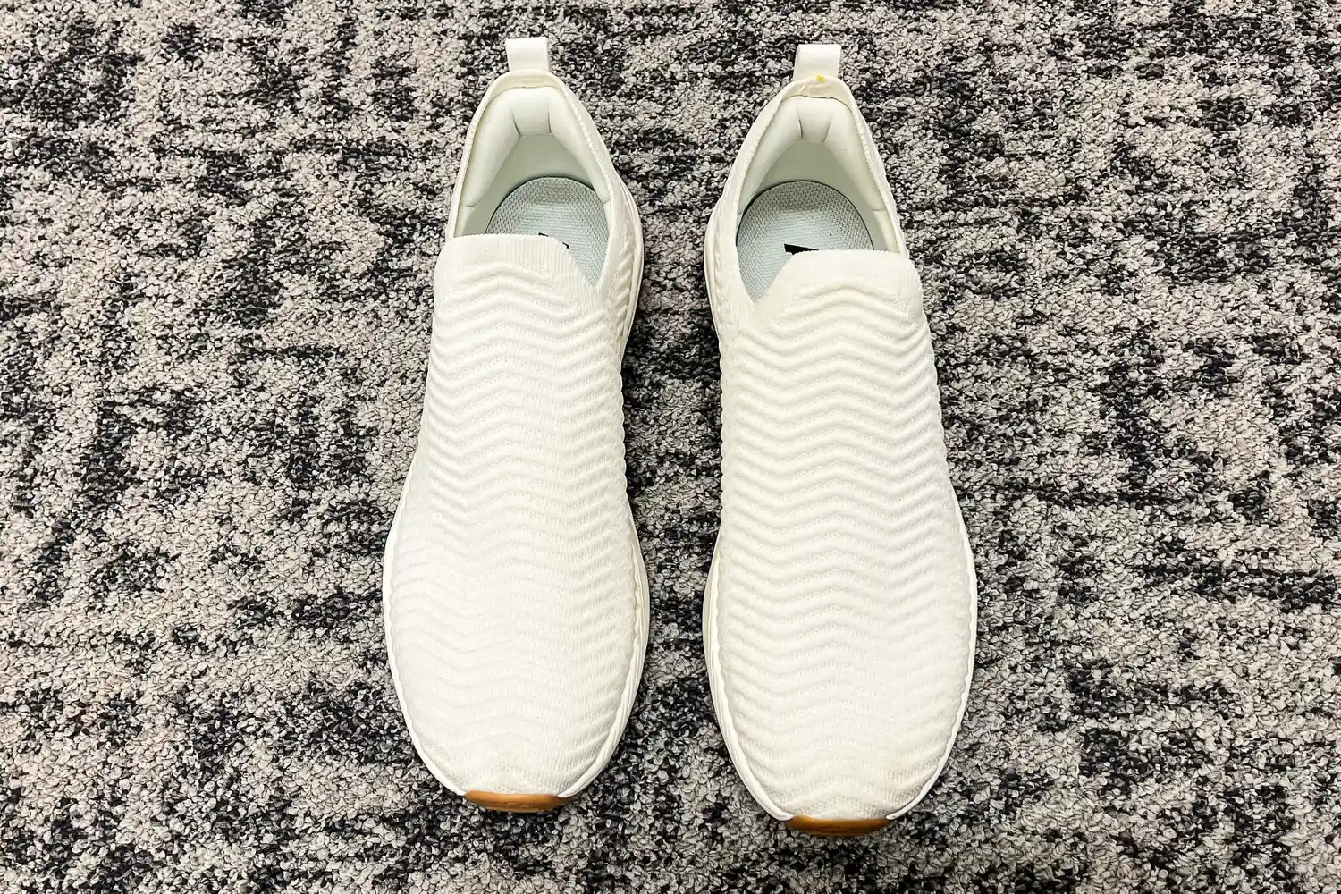 An overhead view of a pair of APL Men's TechLoom Travelers