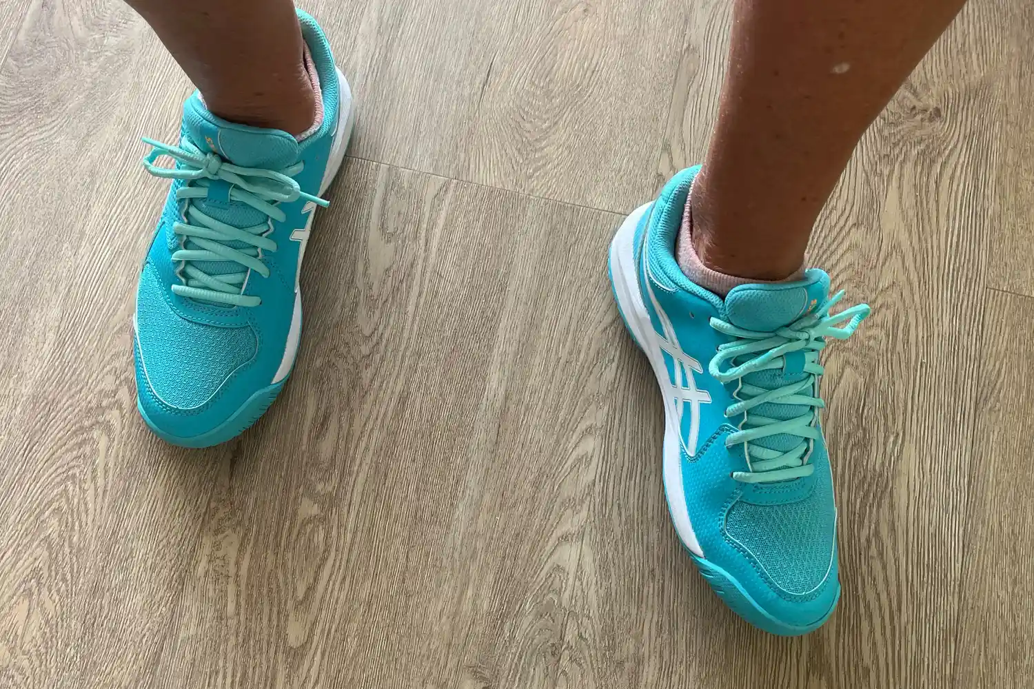 An overhead view of a person wearing the Asics Women's Gel-Dedicate 8 Pickleball Shoes