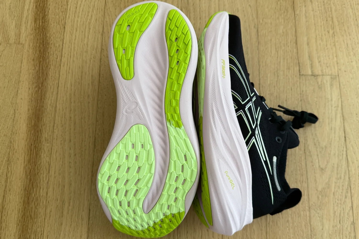 Asics Women's Gel-Nimbus 26 placed on wooden floor