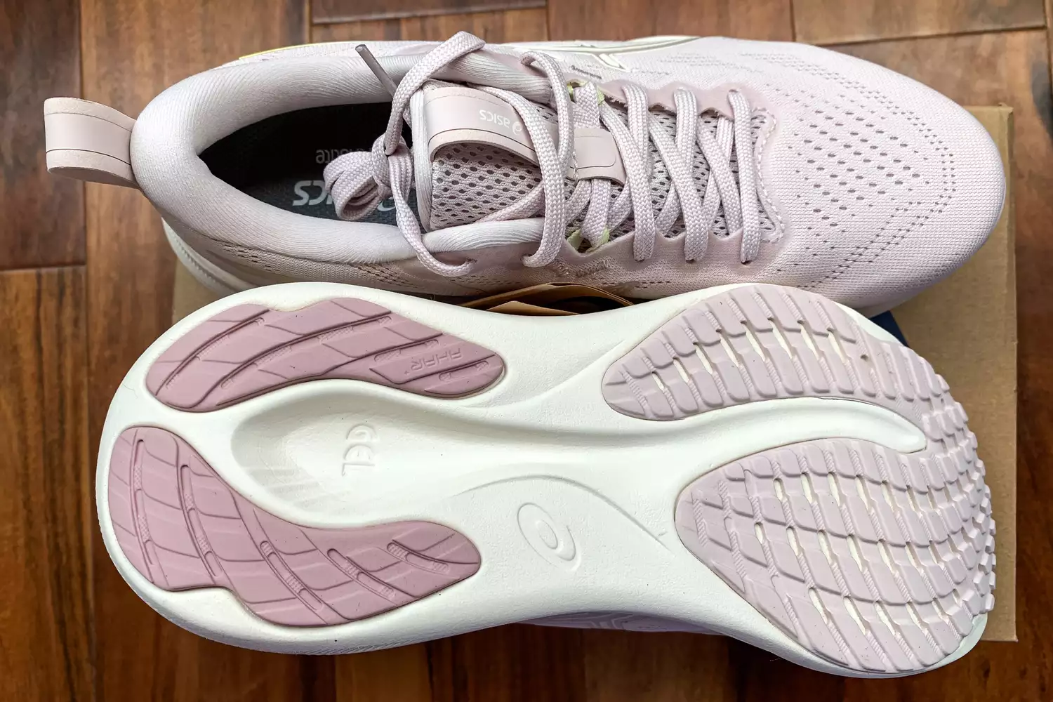 The Asics Women's GEL-Pulse 16 sneakers posed on their box