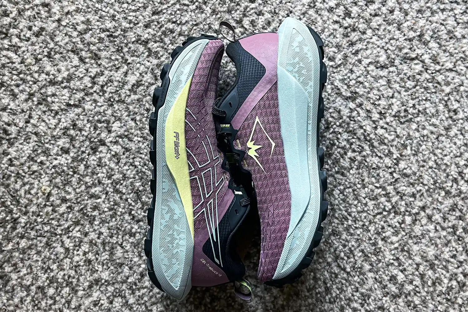 A pair of Asics Women's Gel-Trabuco 13 Trail Running Sneakers side by side on carpet