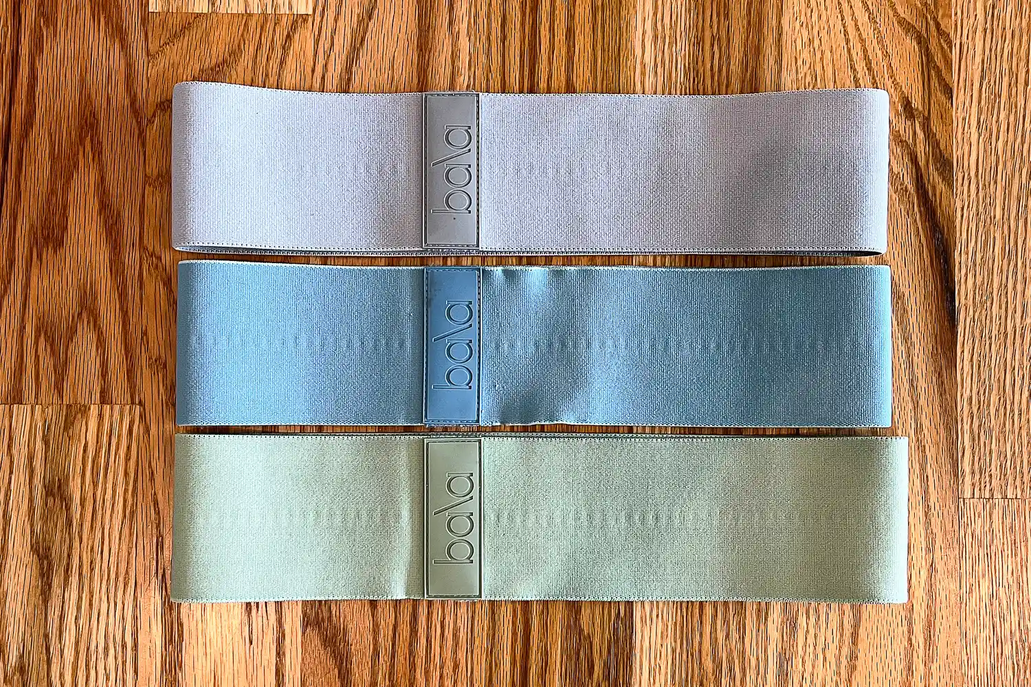 Set of three Bala Bands on a wooden surface