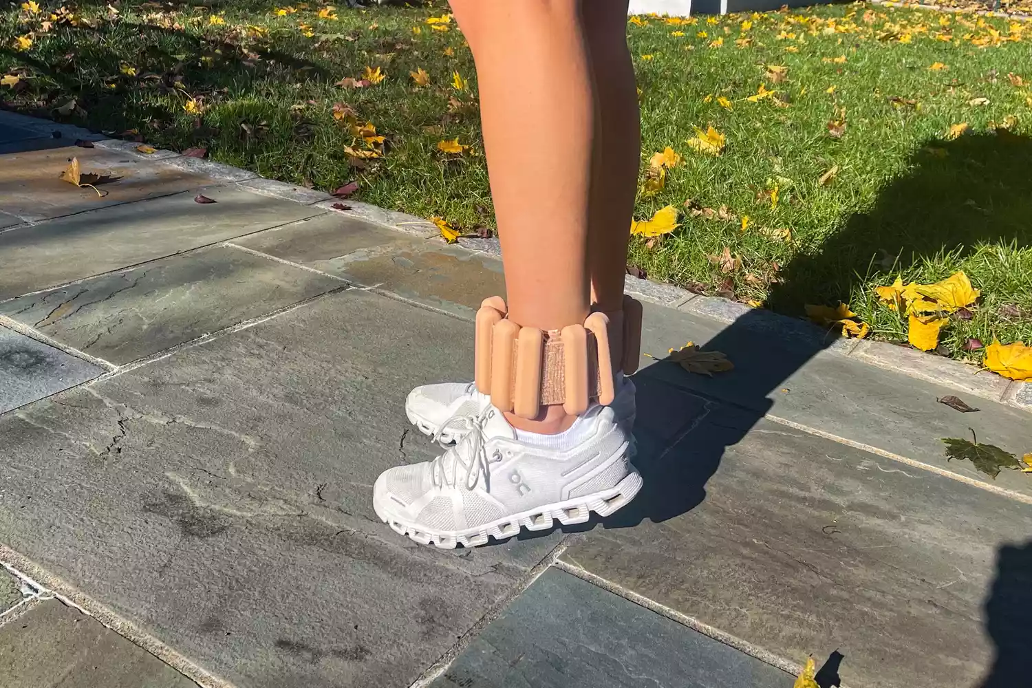 Person wearing Bala Bangles on ankles outside