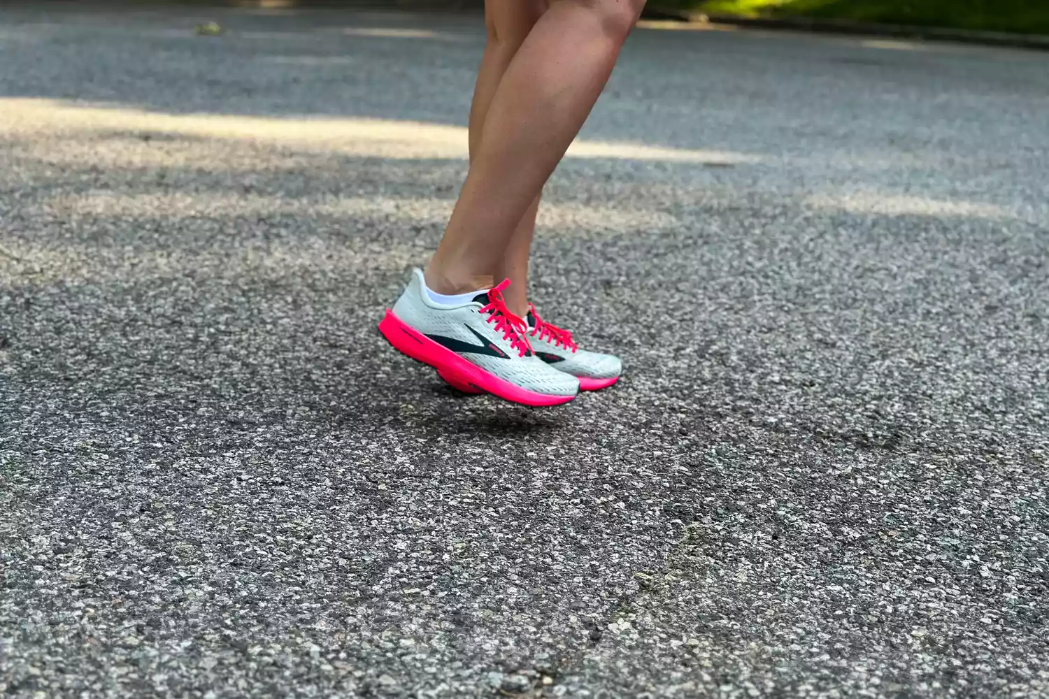 A foot hovering in the air while wearing Brooks Hyperion Tempo Road-Running Shoes