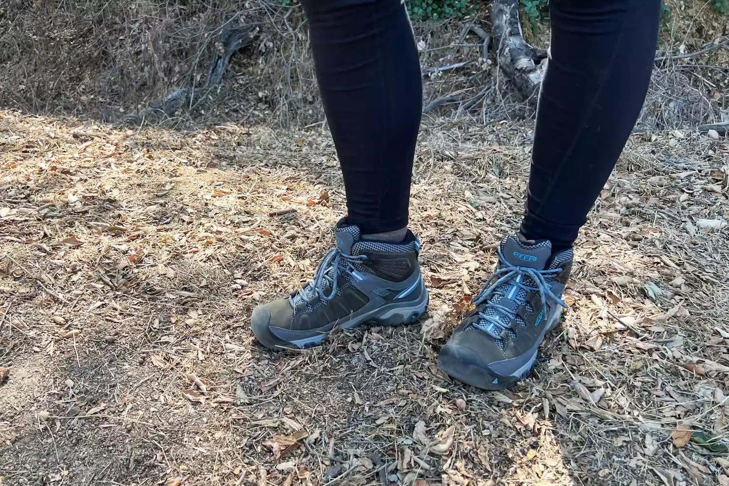 Person wearing KEEN Targhee III Mid Waterproof Hiking Boots standing on a trail