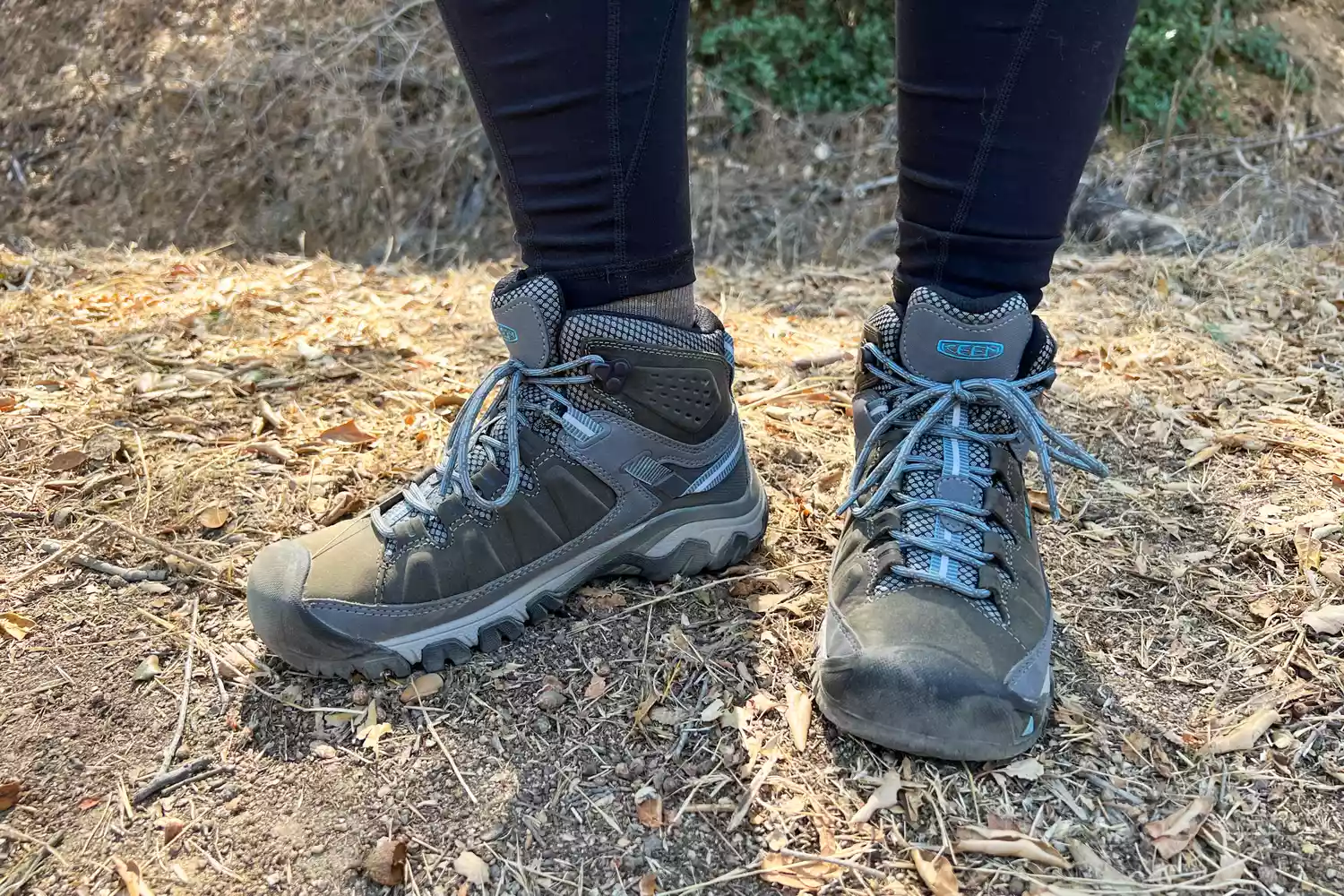 Person wearing KEEN Targhee III Mid Waterproof Hiking Boots standing on a trail