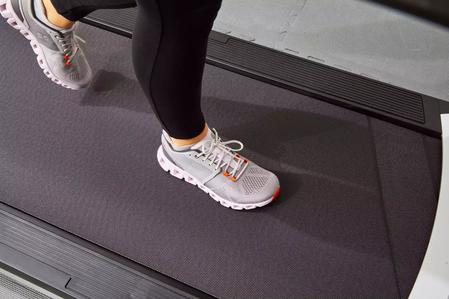 Person wearing On Running Women's Cloud X Running Shoes on treadmill