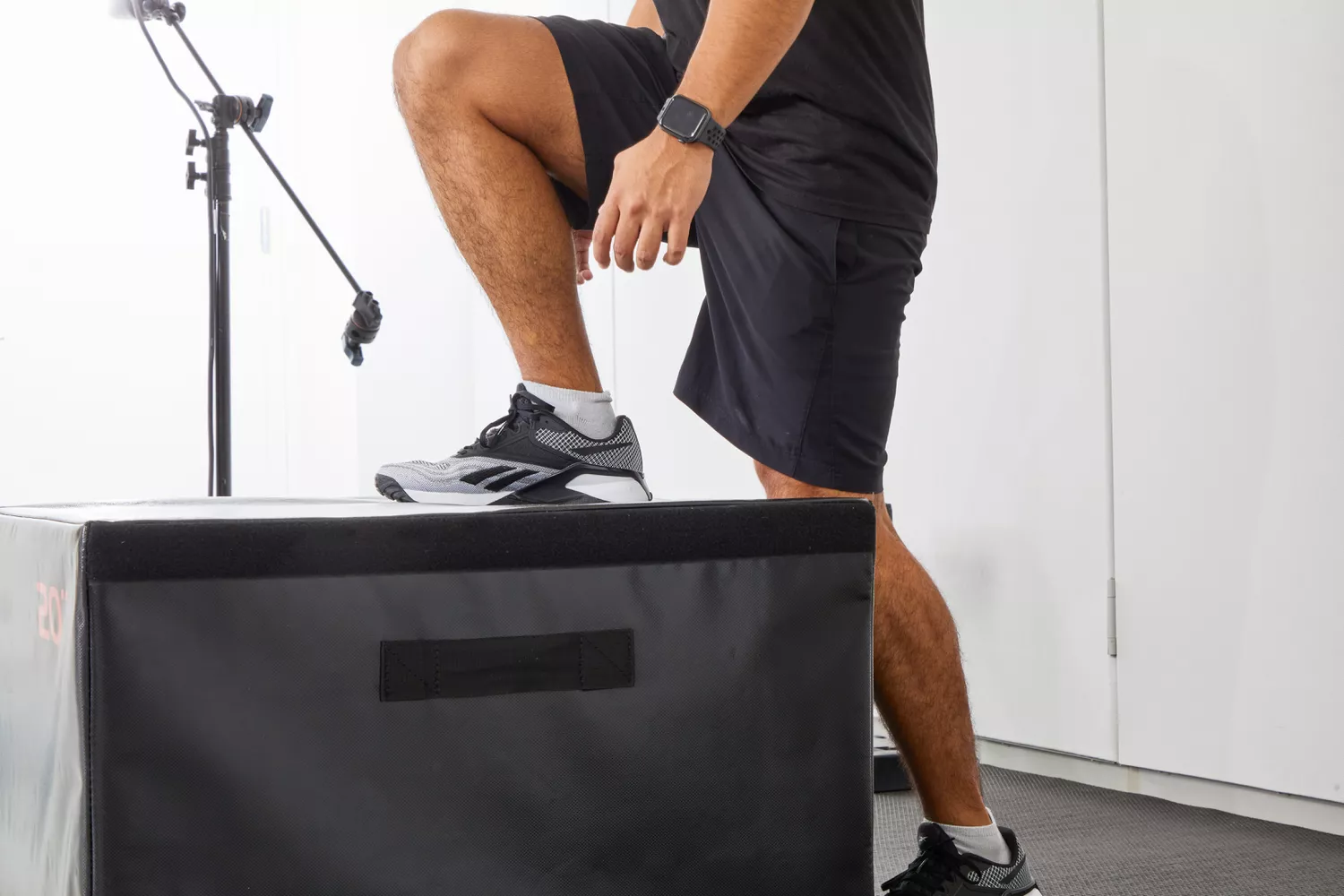 A person stepping up on a box while wearing Reebok Men's Nano X2 Cross Trainers