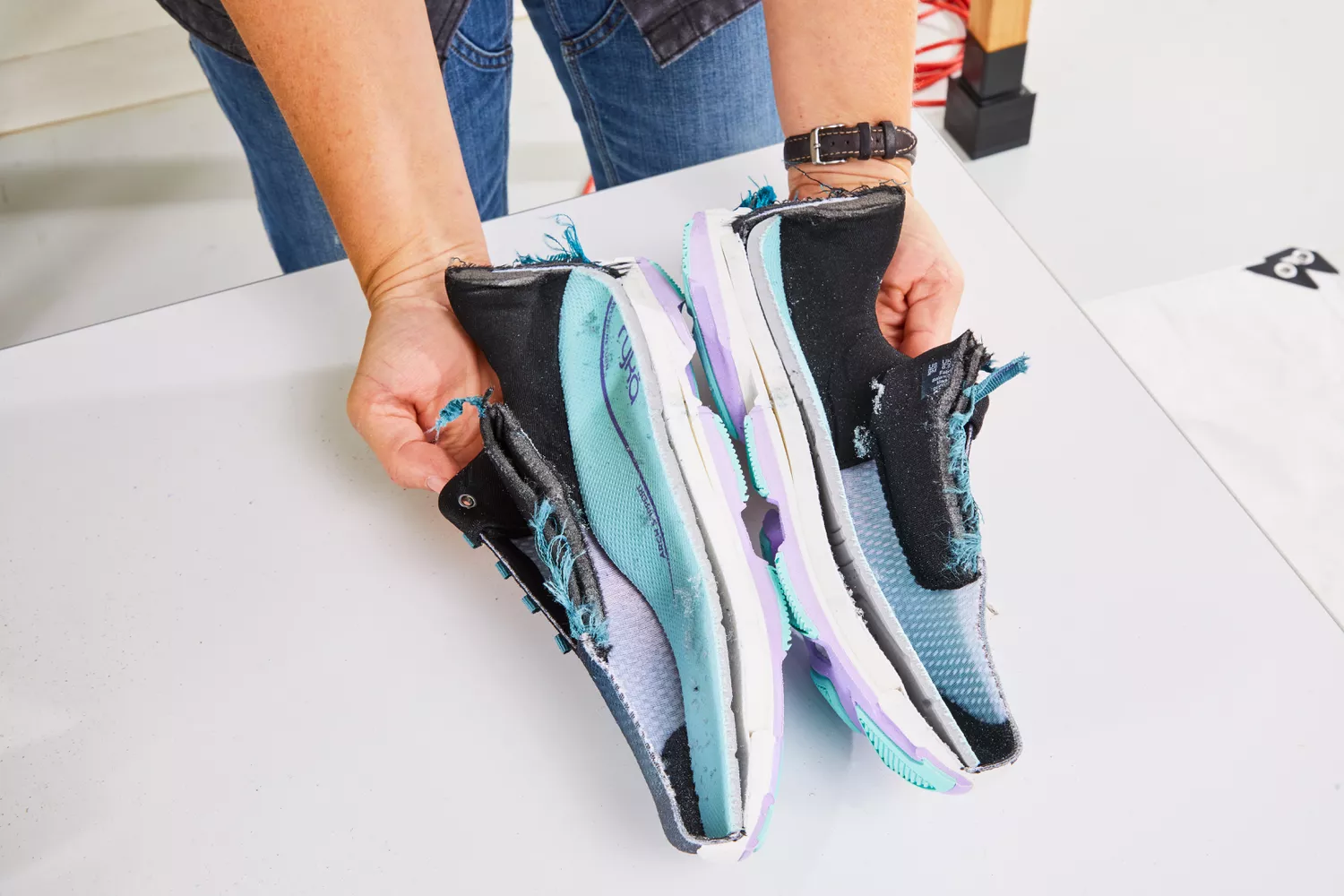 Person holding halves of Ryka Women's Devotion Plus 4 Walking Shoe