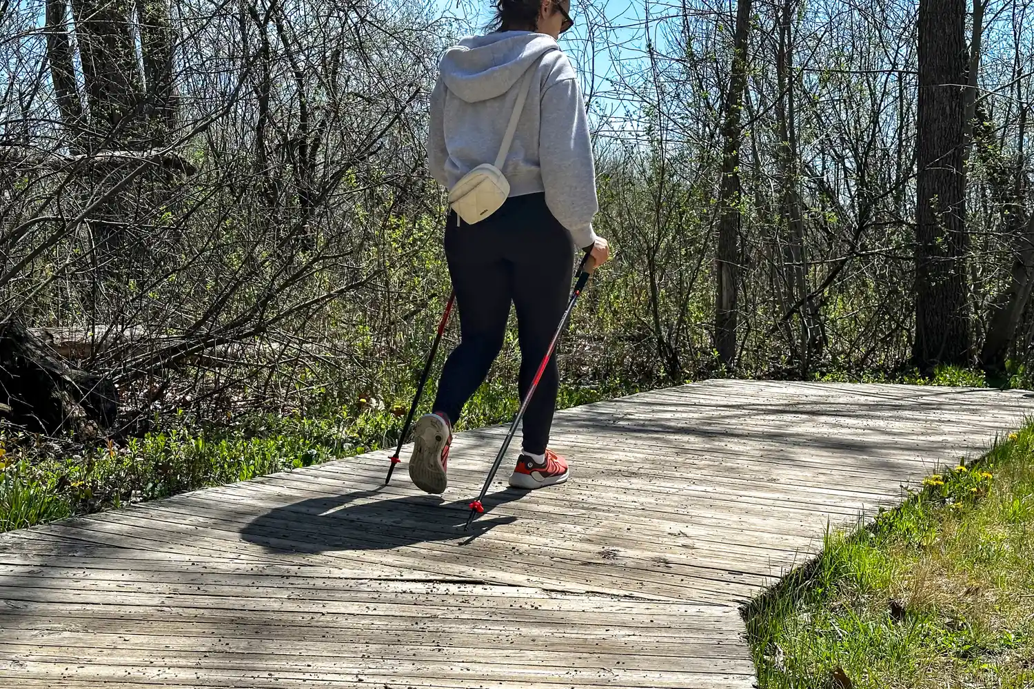 A person uses the Black Diamond Pursuit Carbon Z Poles while walking