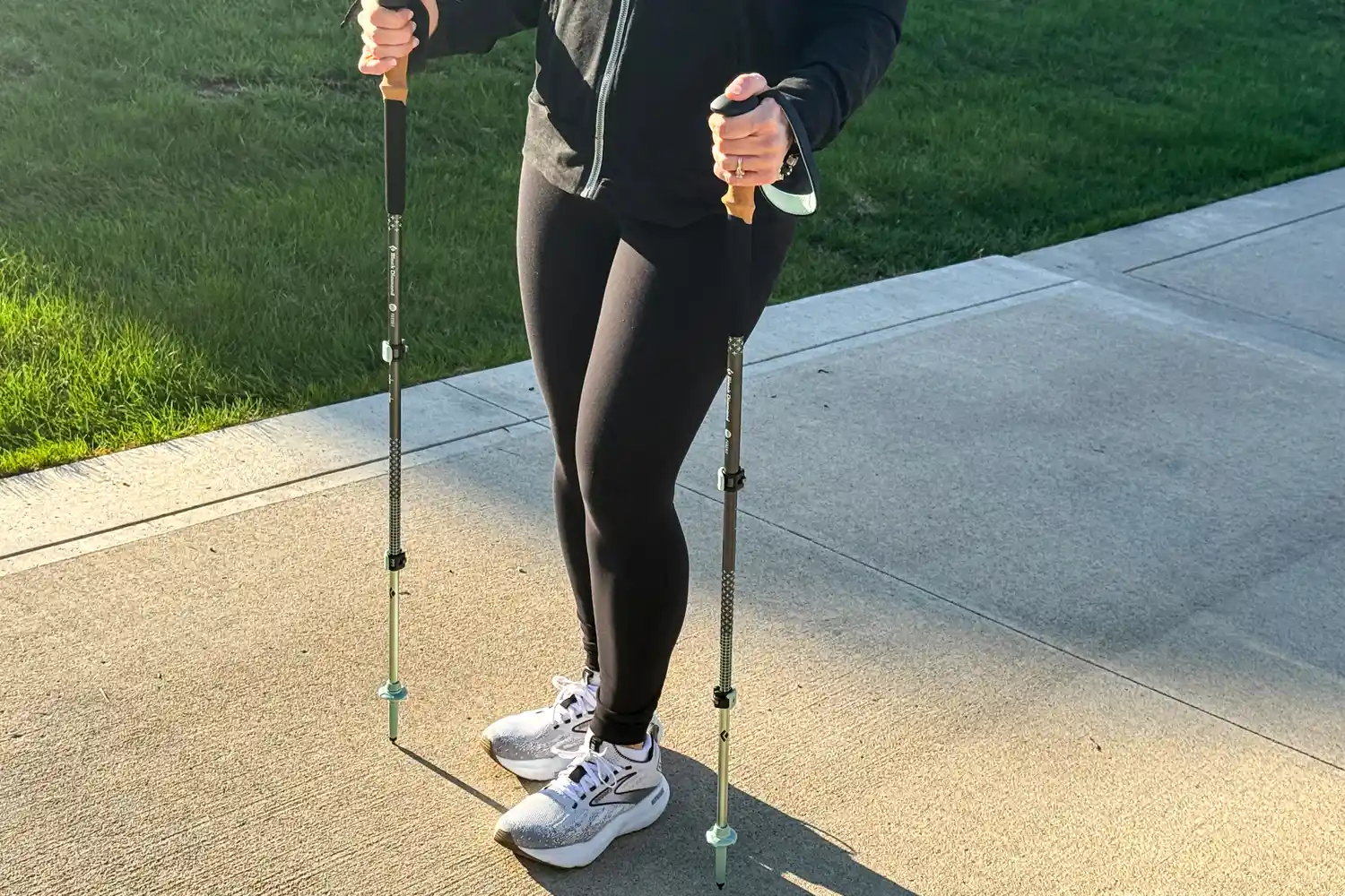 A person walks outside while using the Black Diamond Pursuit Trekking Poles