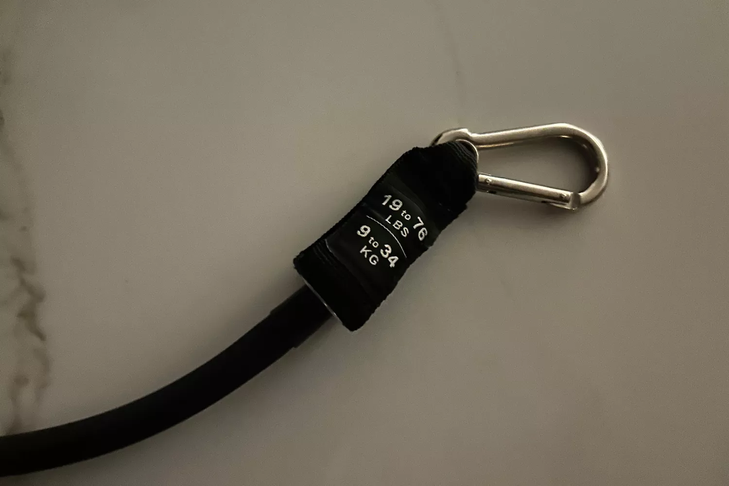 A close-up of the Carabiner Hook of the Bodylastics Resistance Band Set