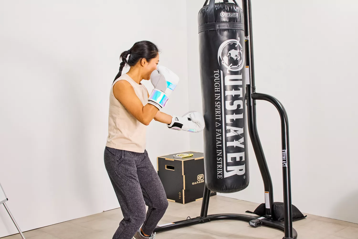A person wears the Hayabusa T3 Boxing Gloves while exercising