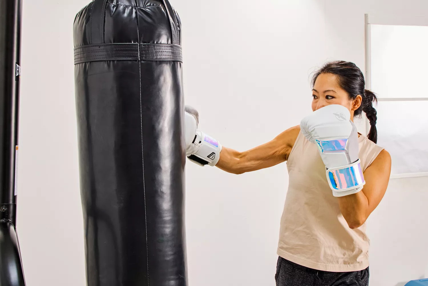 A person wears the Hayabusa T3 Boxing Gloves while exercising