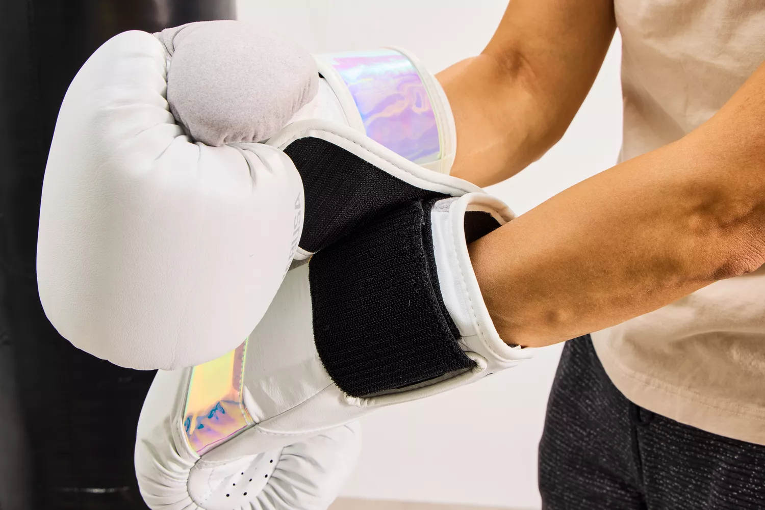 A person secures the Hayabusa T3 Boxing Gloves