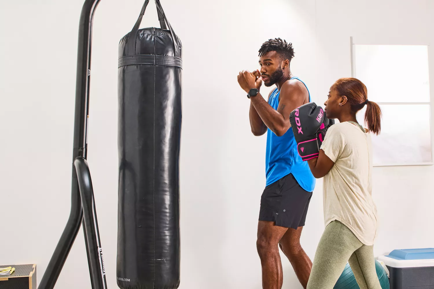 A person wears the RDX Boxing Gloves while boxing
