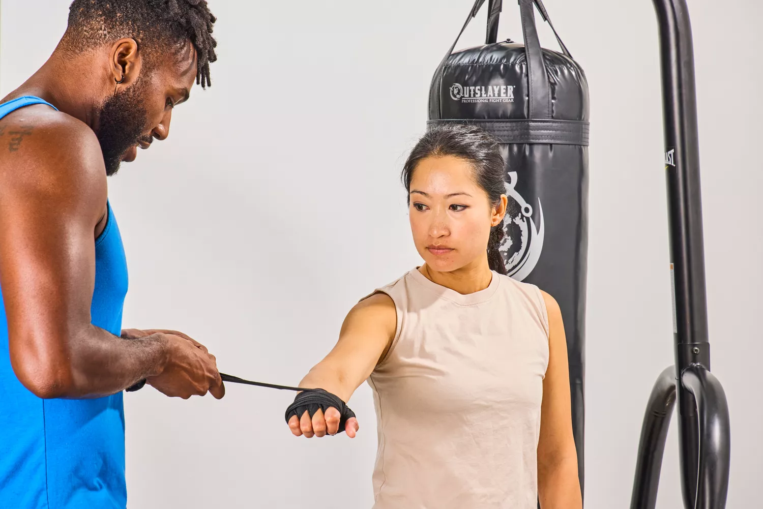 A person gets their hands wrapped before wearing the Venum Elite Boxing Gloves