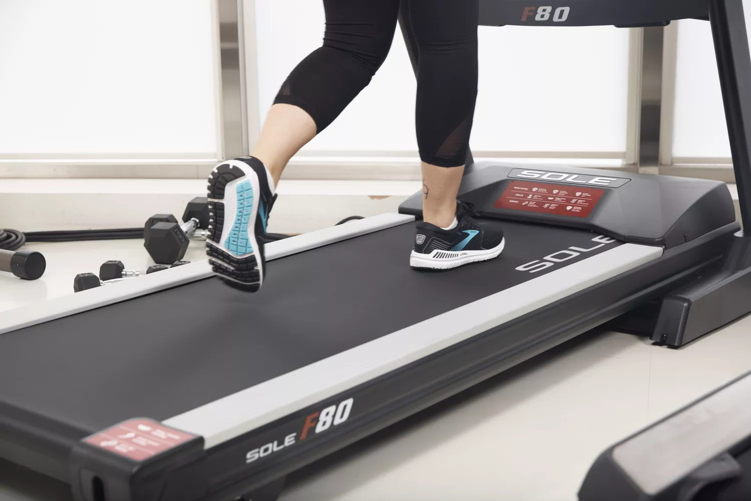 Person wearing Brooks Women’s Ariel '20 Running Shoes walking on treadmill