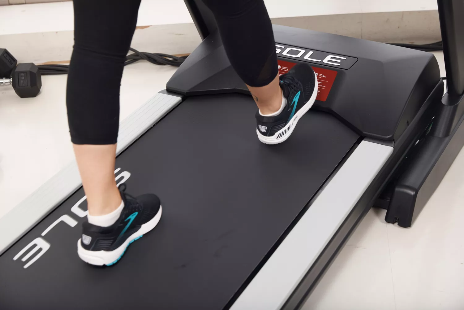 Person wearing Brooks Women’s Ariel '20 Running Shoes walking on treadmill