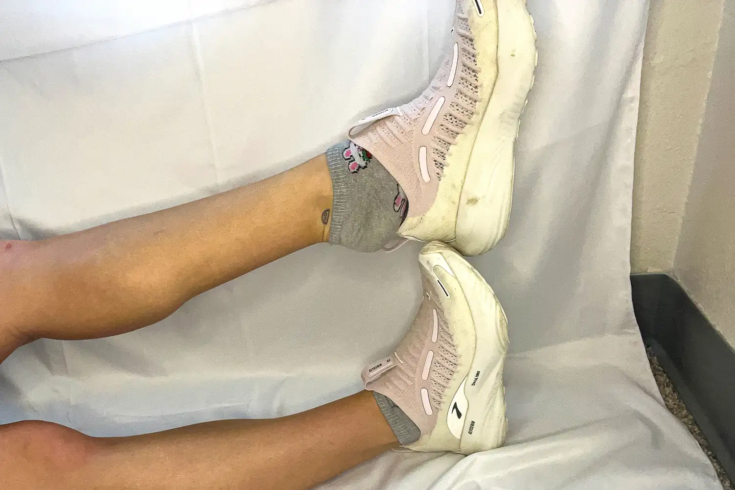 A person removes the Brooks Women's Glycerin 22 SE Running Shoe