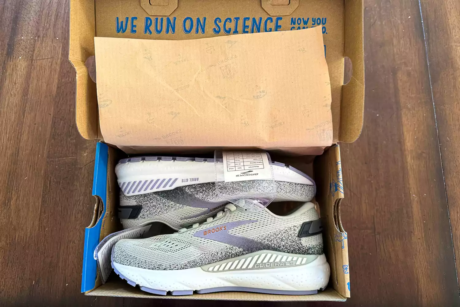A pair of Brooks Women's Ariel GTS 24 Running Shoes inside a shoebox
