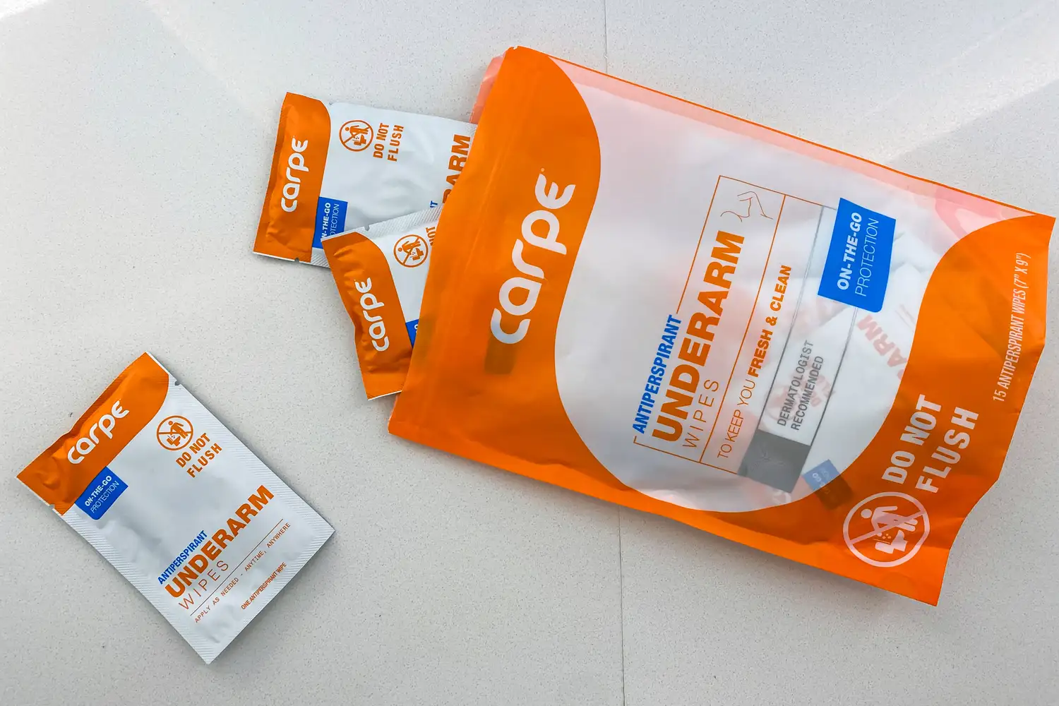 The Carpe On-the-Go Antiperspirant Underarm Wipes in a larger storage bag