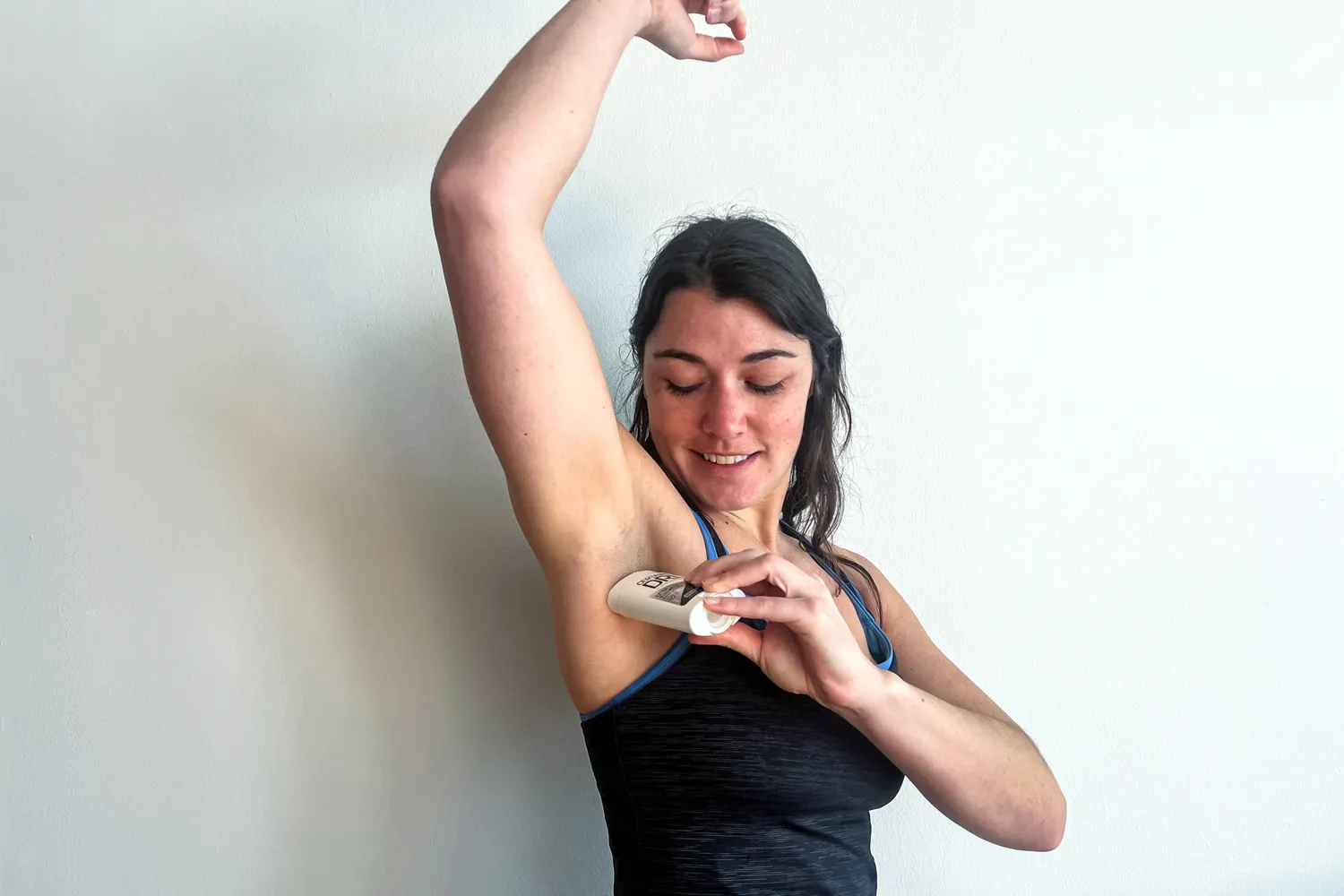 A person applies Certain Dri Extra Strength Antiperspirant Deodorant