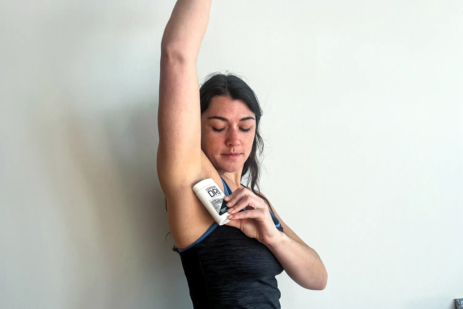 A person applies the Certain Dri Extra Strength Antiperspirant Deodorant