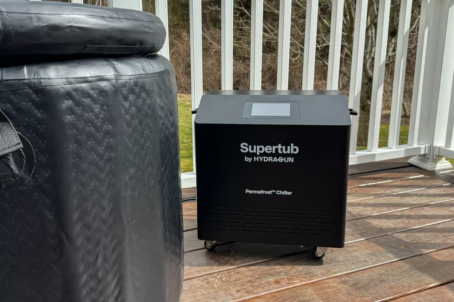 Hydragun Supertub Cold Plunge's Permafrost chiller sitting next to it on a deck