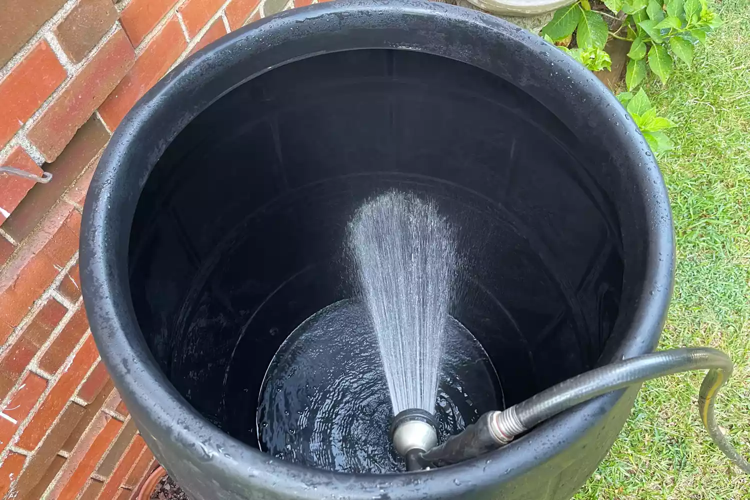 A hose filling the Ice Barrel 400 Cold Therapy Training Tool