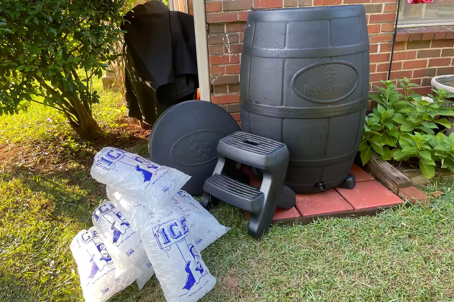 Ice Barrel 400 Cold Therapy Training Tool with bags of ice outdoors on grass