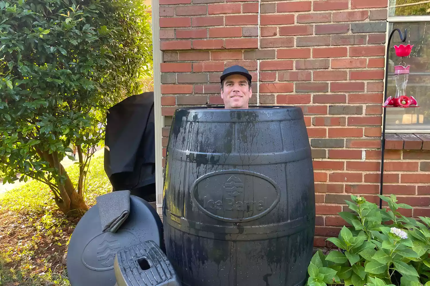 A person sitting in the Ice Barrel 400 Cold Therapy Training Tool