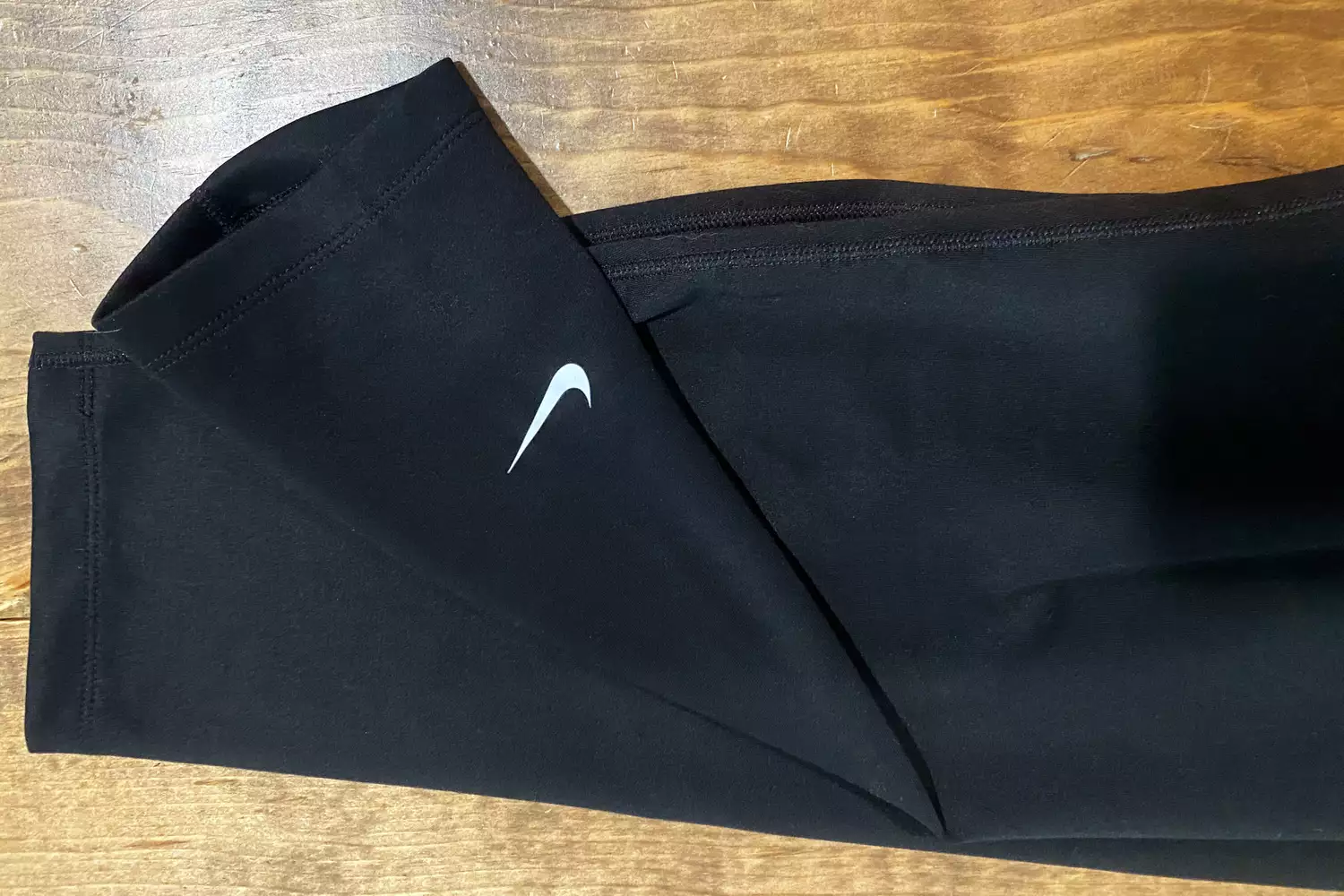 Close up of the logo on Nike Therma-FIT One Womenâs High-Waisted â Leggings