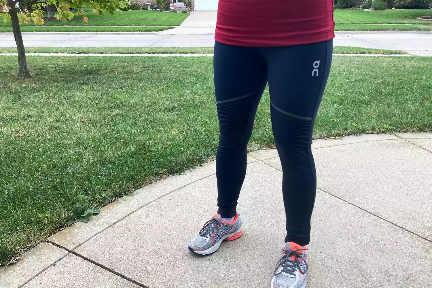 Person outside wearing On Running Women's Tights Long